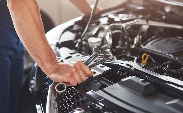 Man fixing a car