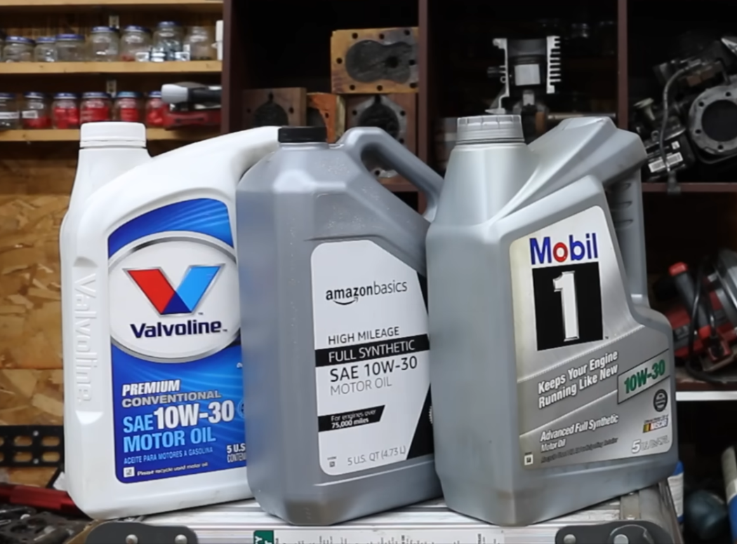 three bottles of oil - valvoline, amazonbasics and mobil 1