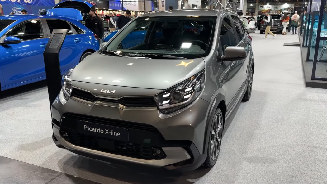 kia picanto gray car in car salon, people near cars