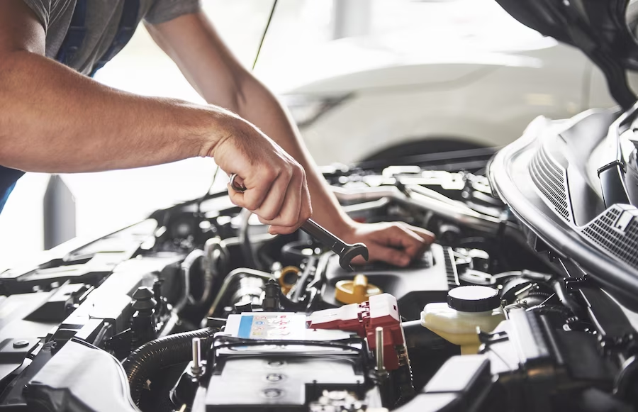 Man fixing a car engine