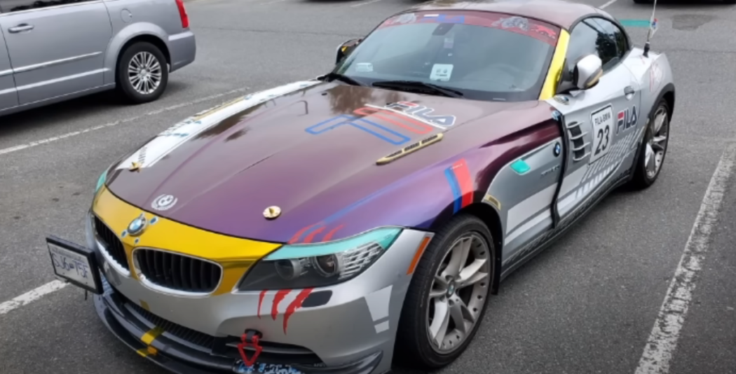 A photo of an old ricer car in a parking lot