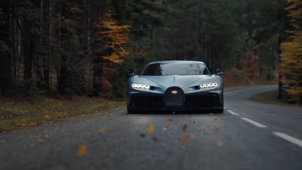 bugatti car on the road, trees in the autumn forest