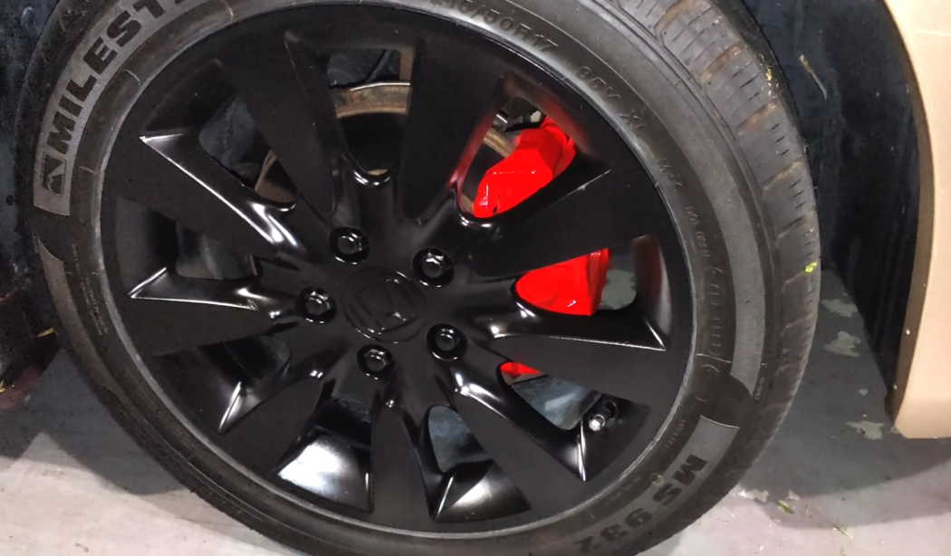 red brake calipers on the car wheel