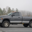 gray Dodge Ram 2500 Cummins 6MT on the parking and tress behind the car