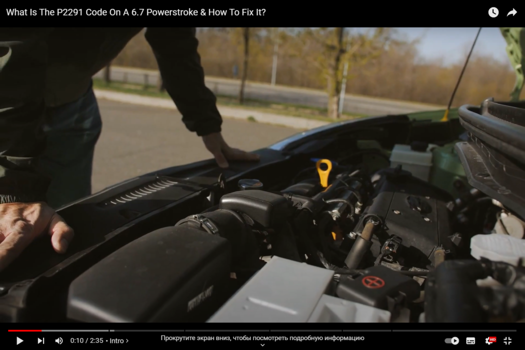 Man looking at a car engine