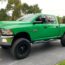 Green Pickup Standing on the Road